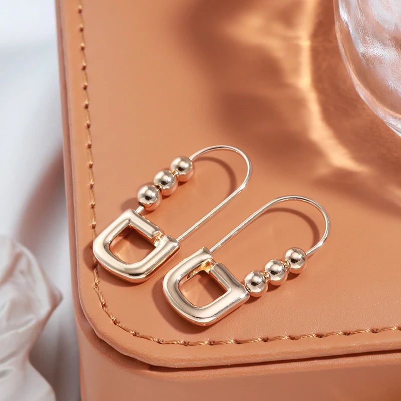 Classic Rose Gold Geometric Dangle Earrings with Glossy Finish – High-Quality Jewelry