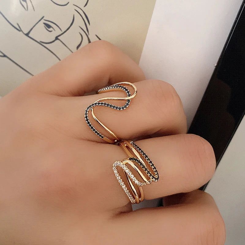 Dignified 585 Rose Gold Twisted Cocktail Ring with Micro Paved Black & White Zircon