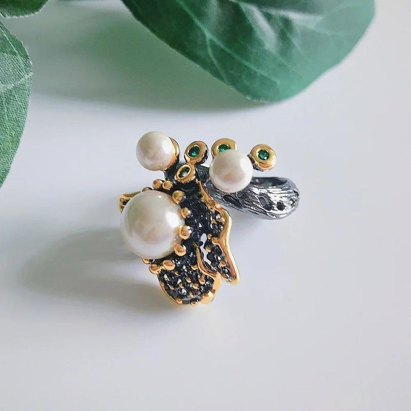 Elegant Blooming Floral Pearl Ring with Green Zirconia in Black Gold Design