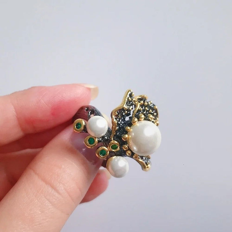 Elegant Blooming Floral Pearl Ring with Green Zirconia in Black Gold Design