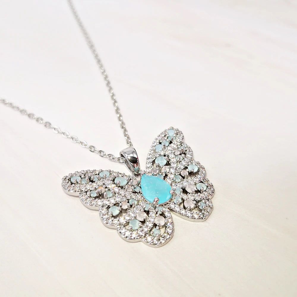 Elegantly Crafted Aquamarine and Pink Opal Butterfly Necklace for Cherished Moments