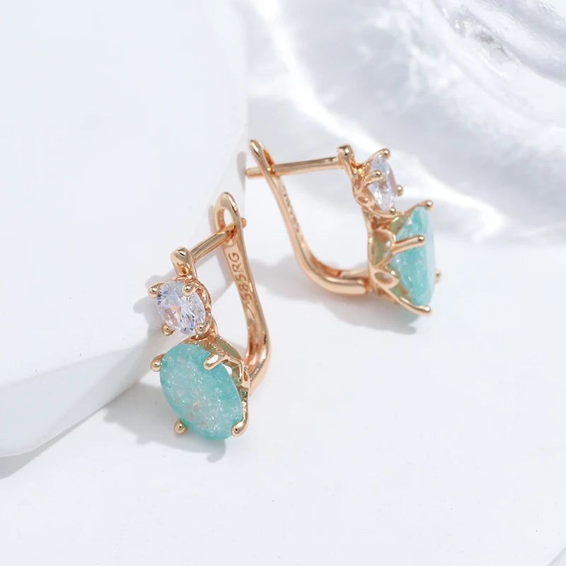 Emerald Elegance: Oval Cut Zircon Drop Earrings in 585 Rose Gold