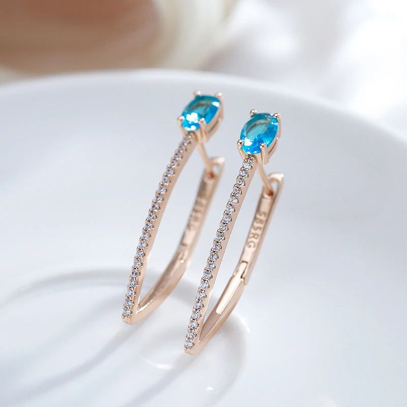 Exquisite Blue Zircon V-Shaped Drop Earrings in 585 Rose Gold - Elegant Holiday Jewelry