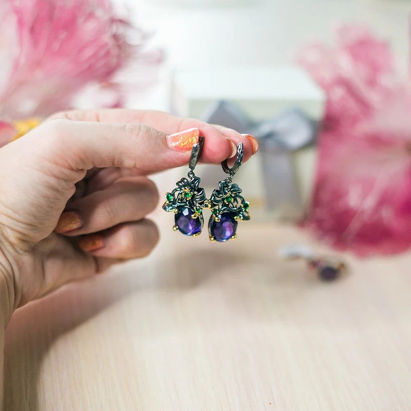 Floral Elegance: Bold Blue CZ Drop Earrings with Gun Black and Gold Accents