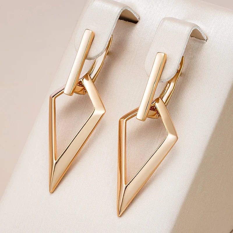 Geometric Elegance: Long Drop Earrings in 585 Rose Gold with Glossy Hollow Design