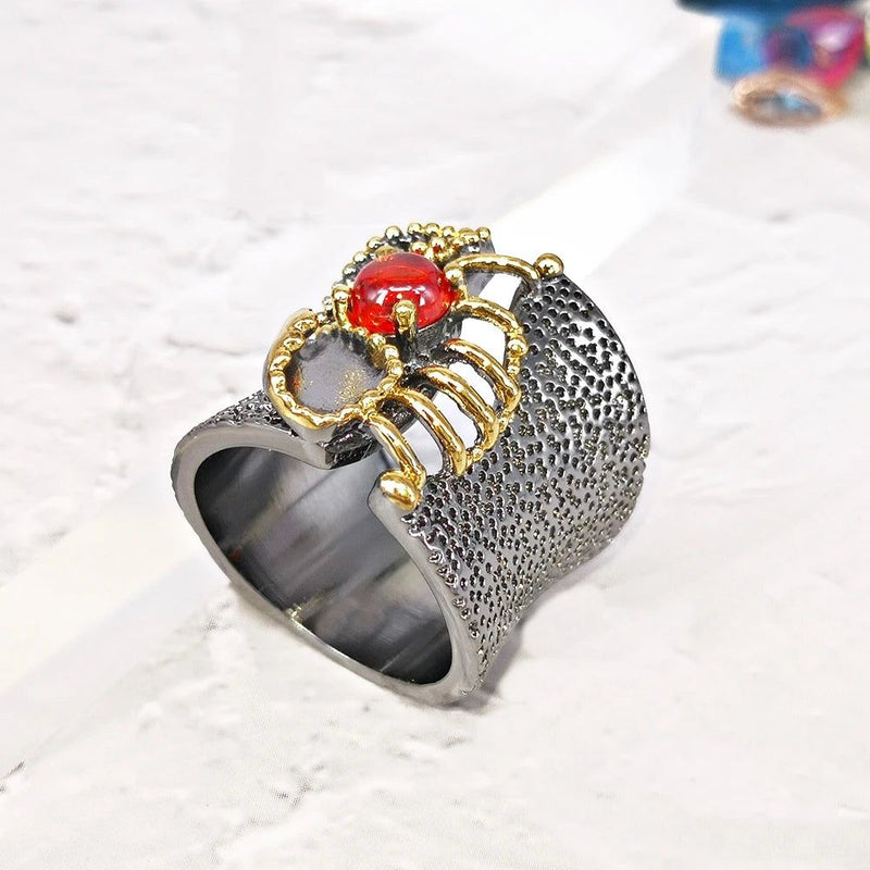 Neo-Gothic Baroque Fissure Ring in Black Gold with Coral-Orange Zircon Accent