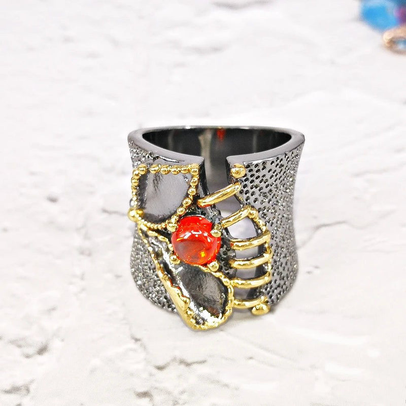 Neo-Gothic Baroque Fissure Ring in Black Gold with Coral-Orange Zircon Accent