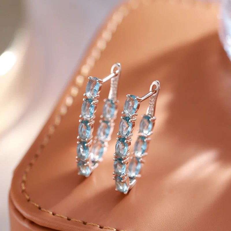 Tasteful Long Drop Earrings with Natural Blue Zircon in 585 Rose Gold