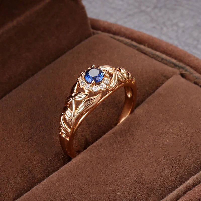 Vintage-Inspired Blue Zircon Rose Gold Cocktail Ring with Hollow Crystal Flower Design