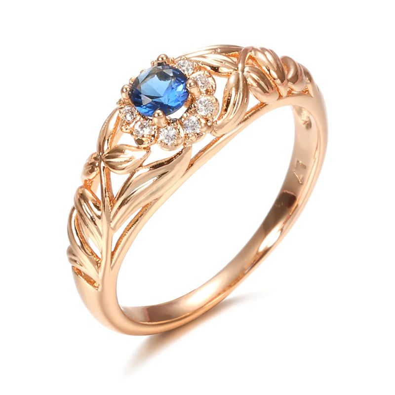 Vintage-Inspired Blue Zircon Rose Gold Cocktail Ring with Hollow Crystal Flower Design