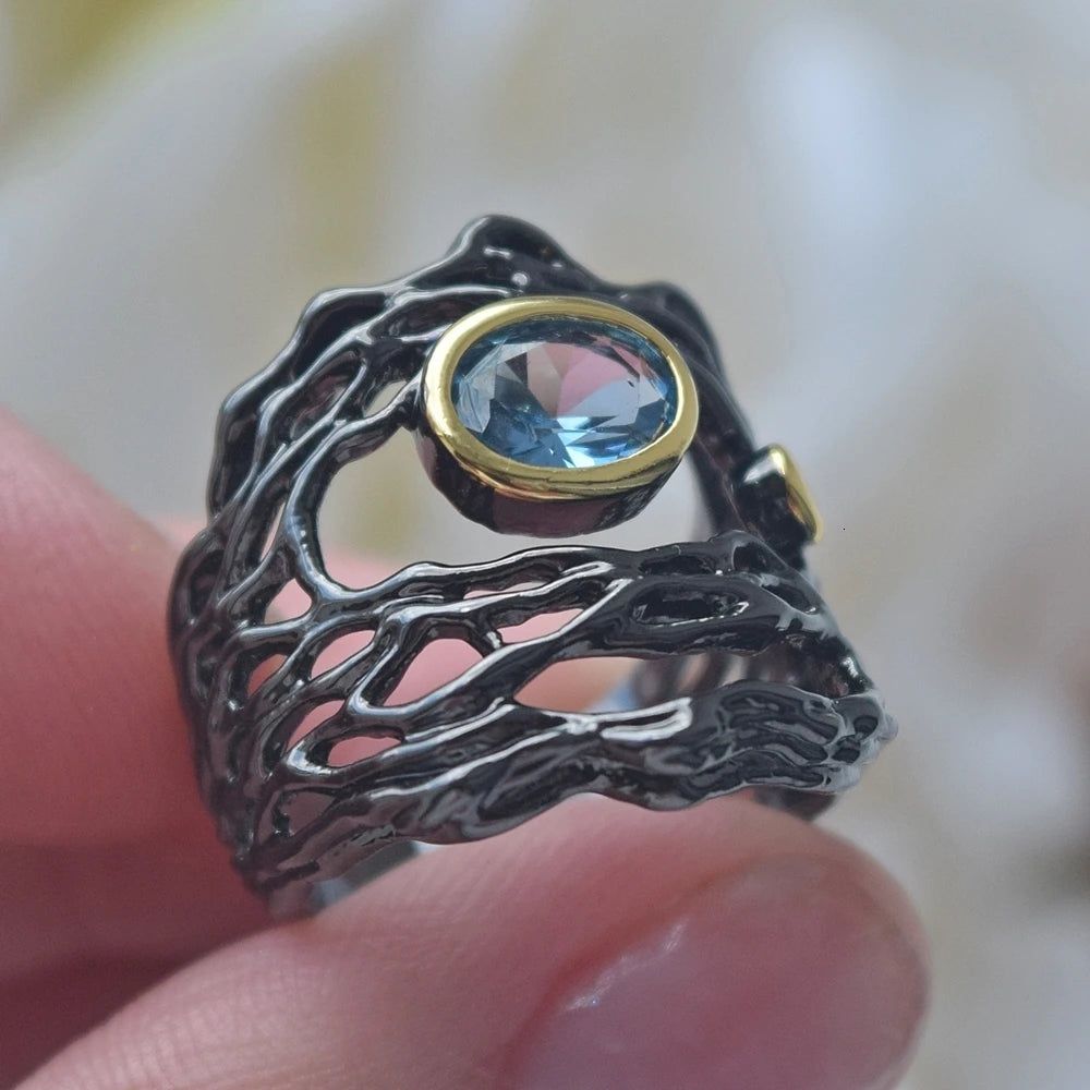 Vintage Neo-Gothic Black Gold Braided Ring with Sea Blue Zirconia