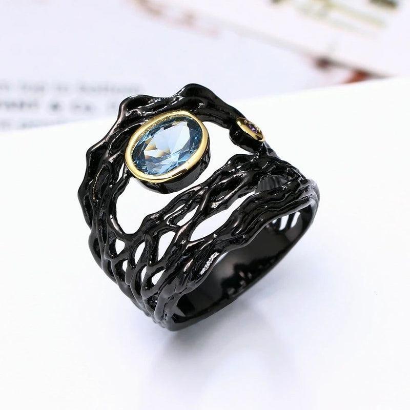 Vintage Neo-Gothic Black Gold Braided Ring with Sea Blue Zirconia