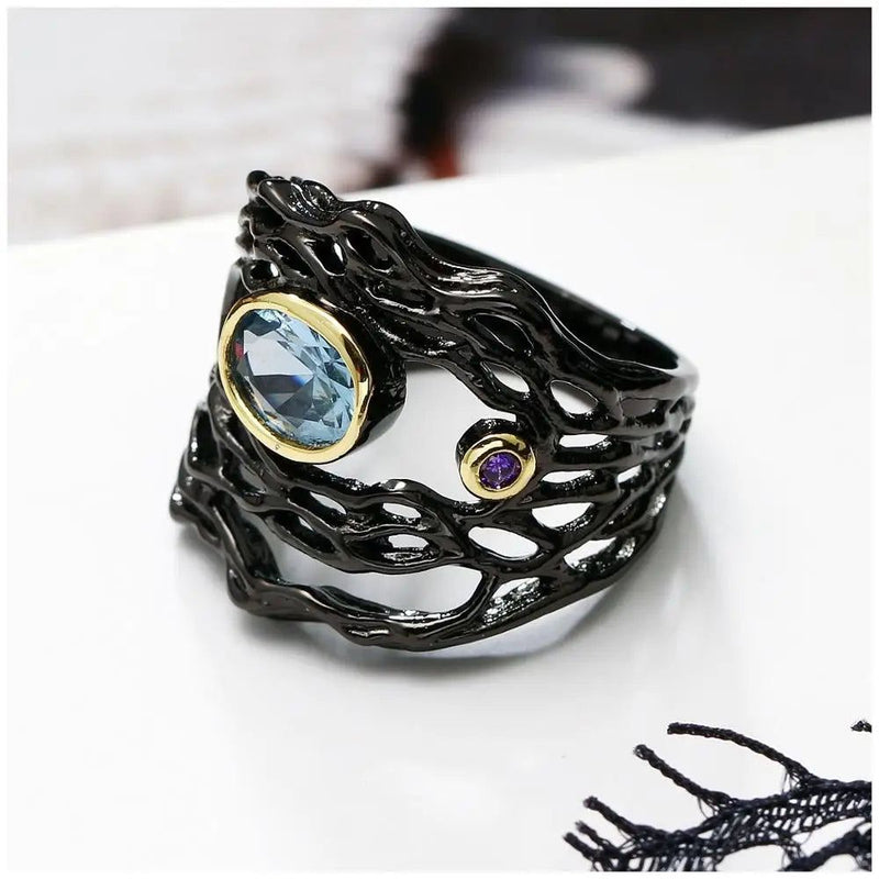 Vintage Neo-Gothic Black Gold Braided Ring with Sea Blue Zirconia