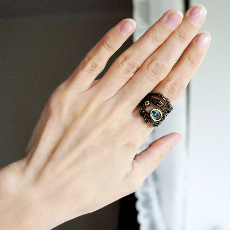 Vintage Neo-Gothic Black Gold Braided Ring with Sea Blue Zirconia