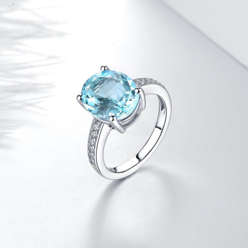 Sterling Silver Statement Cocktail Ring with 5.8ct Oval Sky Blue Topaz and Sparkling White CZ Accents - Lucid Fantasy 