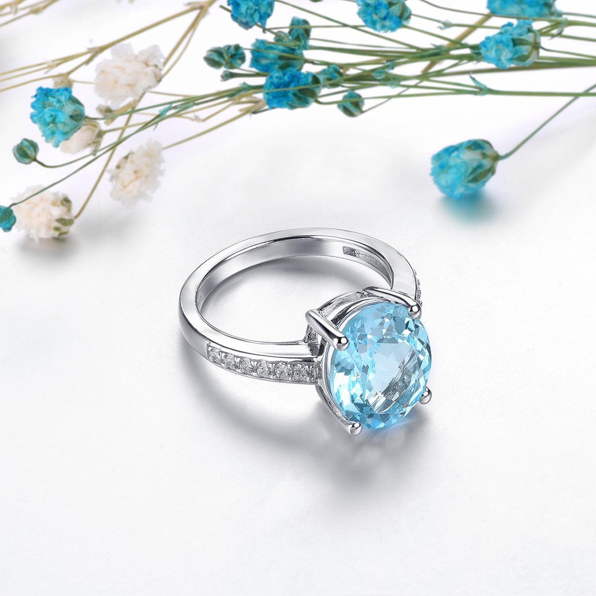 Sterling Silver Statement Cocktail Ring with 5.8ct Oval Sky Blue Topaz and Sparkling White CZ Accents - Lucid Fantasy 