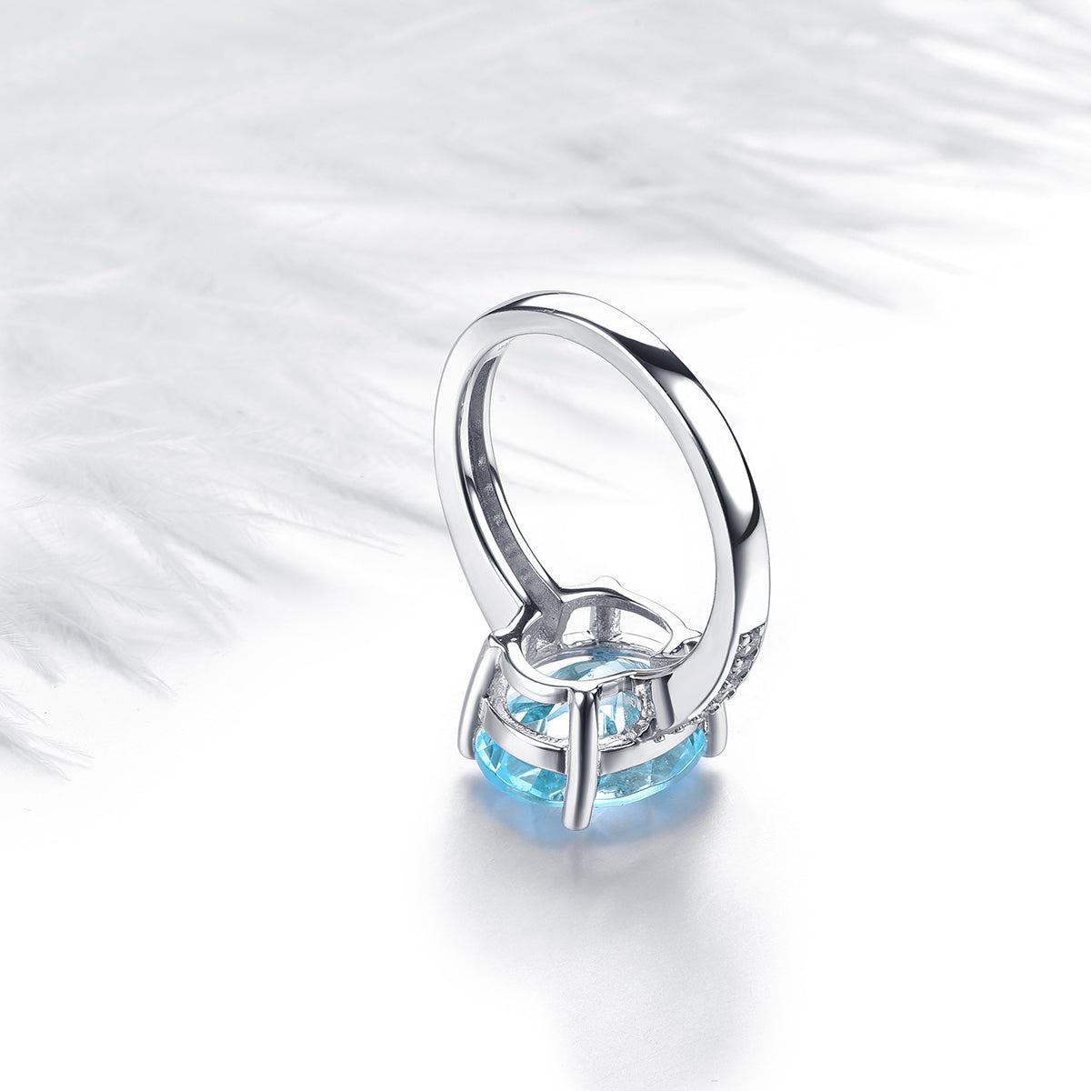 Sterling Silver Statement Cocktail Ring with 5.8ct Oval Sky Blue Topaz and Sparkling White CZ Accents - Lucid Fantasy 