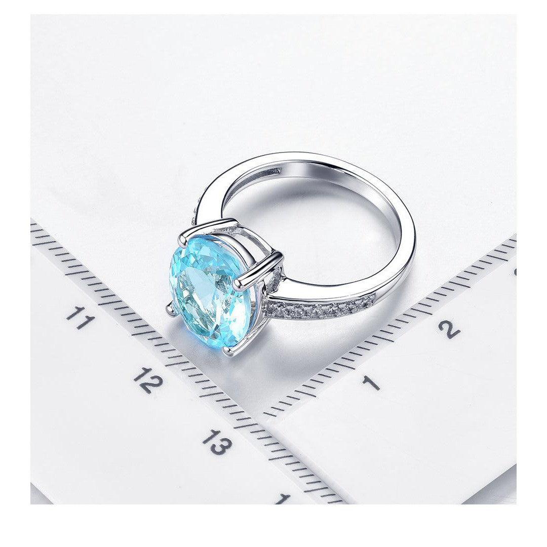 Sterling Silver Statement Cocktail Ring with 5.8ct Oval Sky Blue Topaz and Sparkling White CZ Accents - Lucid Fantasy 